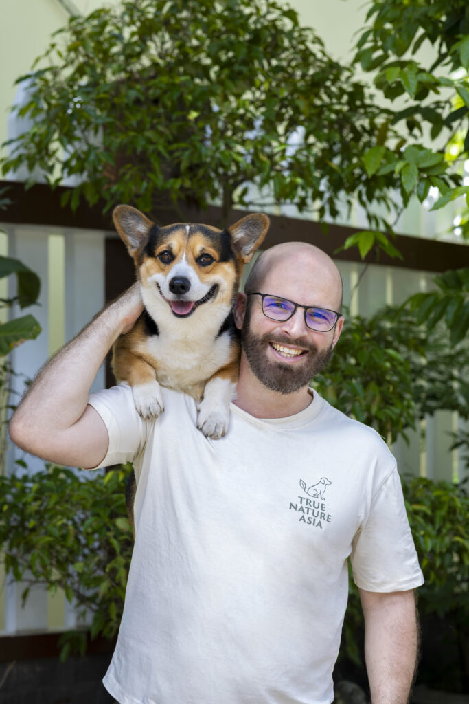 Michael Hornbogen, founder of True Nature Asia, holding his corgi Kooza
