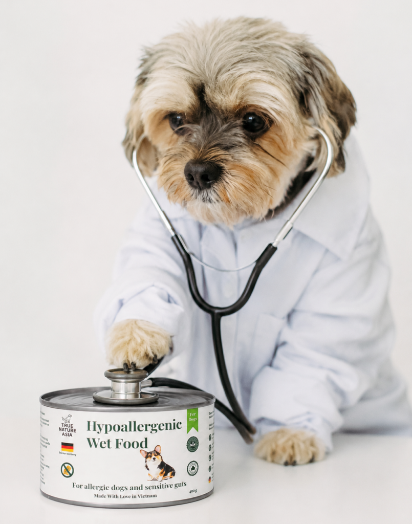 Small dog wearing a vet's lab coat and stethoscope, beside a can of True Nature Asia hypoallergenic wet food